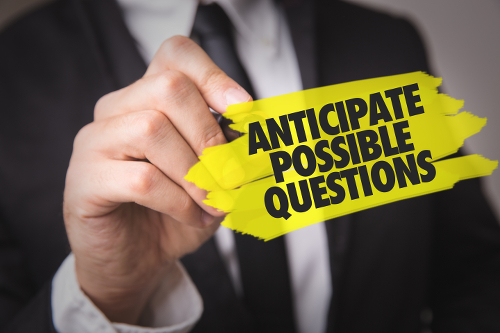 An image of a man in a suit and tie, using a yellow highlighter to highlight the words "Anticipate possible questions" in black bold letters.